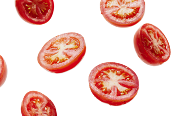 Fresh, juicy tomato slices scattered against a dark background