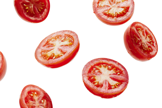 Fresh, juicy tomato slices scattered against a dark background