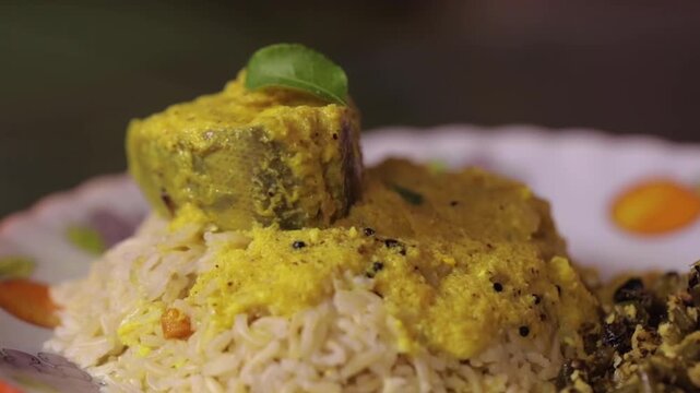 Closeup shot of serving fish curry with rice.
