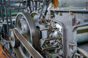 Obraz premium Exploring the intricate mechanisms of a carding machine in an industrial textile workshop during the morning hours