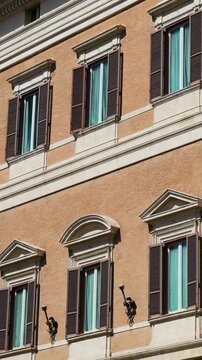 outer palazzo montecitorio palace rome windows painted walls building&rsquo;s exterior decorative view architectural features historic building cultural heritage urban landmark 