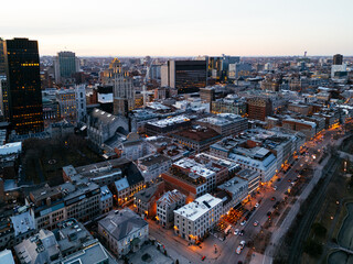 Fototapeta premium Montreal evening skyline with illuminated streets in Old Port district. g.