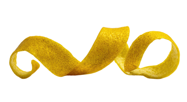 Twisted yellow citrus peel against a black background