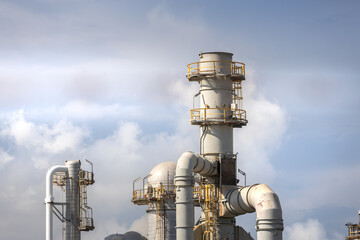 oil refinery petrochemical plant oil gas and energy production with flare stack smoke pollution emission, chemical and polymer production engineering technology for climate change control efficiency