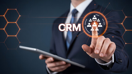 Professional businessman touches digital CRM interface for customer relationship management success