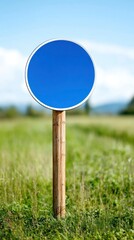 Empty Blue Sign on a Green Field