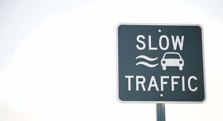 Slow traffic winter sign on grey background  