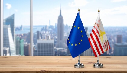 US and EU table flags on wooden surface with urban backdrop, symbolizing diplomacy and cooperation.