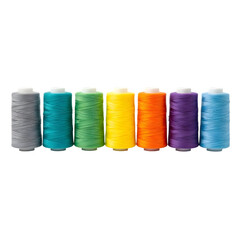 Rainbow of Thread Spools Lined Up on Black Background sewing craft isolated on a transparent background
