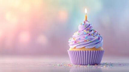 Cupcake topped with lavender frosting and rainbow sprinkles lit candle rising from center soft haze adds depth background