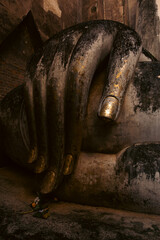 Monumental Buddha image Phra Atchana in subduing mara posture at Wat Sri Chum temple Sukhothai...
