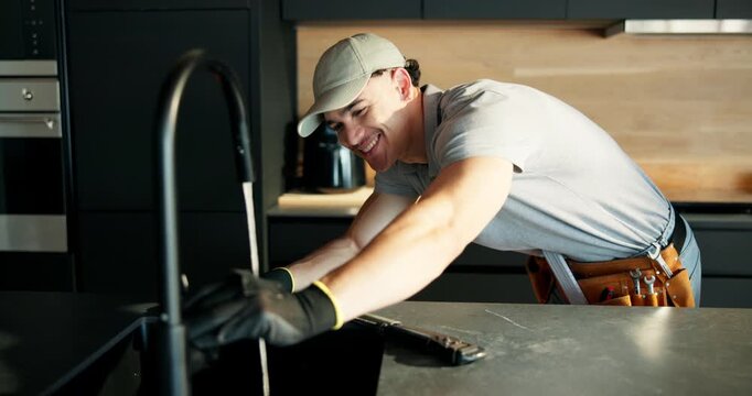 Man, plumber and wrench in kitchen with faucet installation with smile, water flow and renovation at house. Person, tap and plumbing tools for sink, home improvement or happy for property development