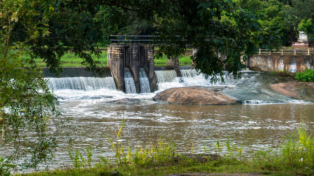 Scenic View of a check dam with Water Cascading over Rocks at Cheramangalam check dam in Palakkad, Kerala,