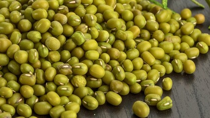 Close up of a pile of small green mung beans