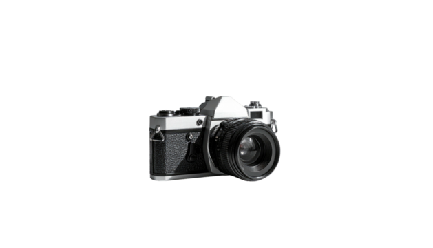 Old film camera with textured grip on stark black background