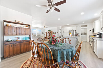 A modern kitchen with stainless steel appliances and wooden cabinets