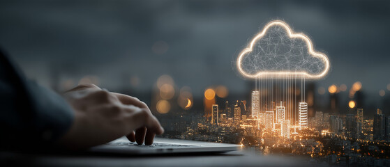 Man typing on laptop with glowing cloud computing network over illuminated city skyline