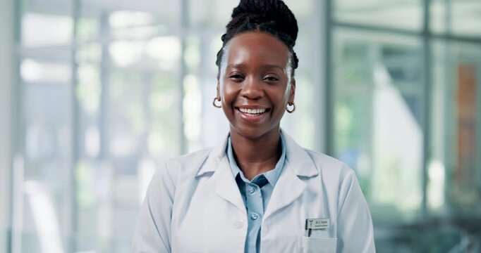 Happy, black woman and face of doctor in hospital with confidence for healthcare career with tablet. Professional, technology and portrait of African surgeon with pride for medical help in clinic.