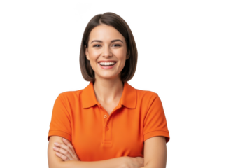 A cheerful young woman with short brown hair and a bright smile wearing an orange polo shirt with her arms crossed isolated on transparent background