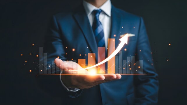 Businessman holding a glowing orange bar graph with rising arrow, symbolizing financial growth, business success, performance improvement, data analytics, and futuristic economic progress