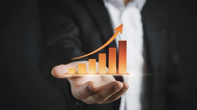 Businessman holding a glowing orange bar graph with rising arrow, symbolizing financial growth, business success, performance improvement, data analytics, and futuristic economic progress