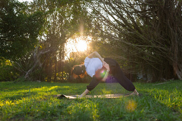 Woman practicing yoga in the park