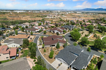 Fototapeta premium Aerial view of a residential area with many houses and trees