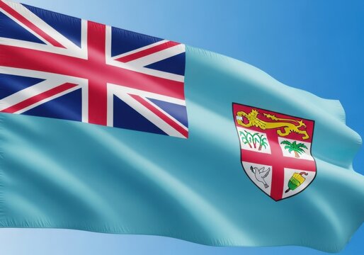 The flag of fiji, a light blue ensign with the union jack and fijian coat of arms, waving gently against a clear blue sky
