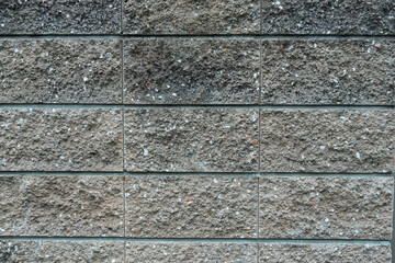 風化と経年劣化によるテクスチャ：劣化したコンクリート風ブロックのクローズアップ