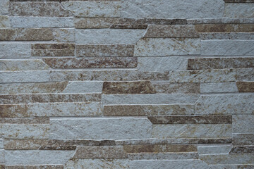 風化と経年劣化によるテクスチャ：タイルっぽい壁のクローズアップ