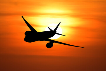 Skyward Silhouette: A powerful silhouette of an aircraft soars against the backdrop of a blazing sunset. Embracing the beauty of aviation.