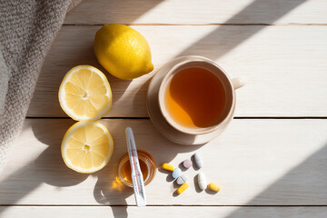 Comforting Cold Relief with Tea, Lemon, and Medicine