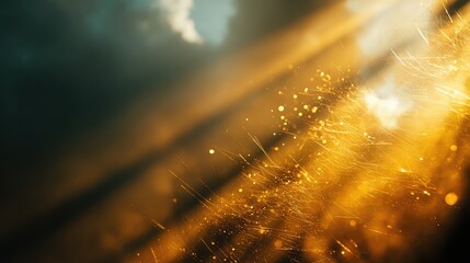 Golden sunlight beaming through dark sky with particles