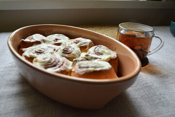 Homemade Cinnamon Rolls Cinnabon with Frosting. Warm Breakfast. Coffee Tea. Cozy Hygge.
