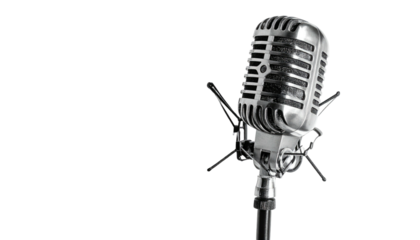 Vintage microphone isolated against a stark, dark background