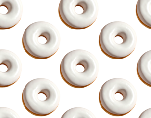 Close-up view of glazed doughnuts arranged in a pattern on a black backdrop. The perfect circular pastries display a creamy white frosting