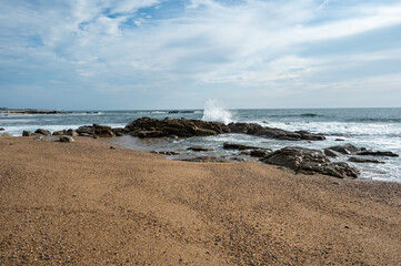 Praia de Canide, Canide Beach, on northern coast of Portugal in Vila Nova de Gaia under dramatic autumn cloudscape.