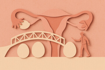Obraz premium Conceptual paper cut illustration of fertility and reproduction. miniature engineer guides an egg over fallopian tube bridge, hopeful journey in gynecology and science