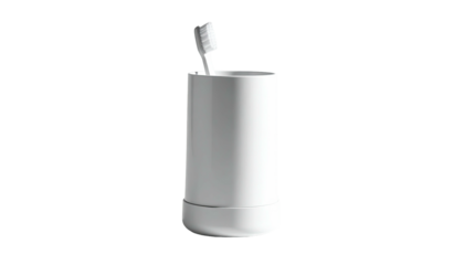 Toothbrush in simple white cylindrical holder