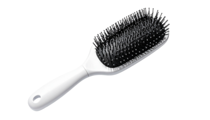 White handled hairbrush with dense black bristles on black