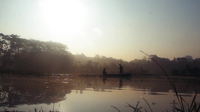 Tranquil Lakeside Morning Landscape with Golden Grass, Misty Reflections, and Dense Forest Silhouette &ndash; Serene Nature Scenery, Peaceful Water Surface, Sunrise Light, Tropical Countryside Environment