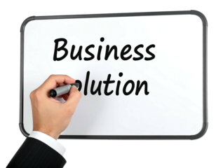 Close-up of a whiteboard with handwritten text "Business solution", a suited hand holding a black marker. Isolated