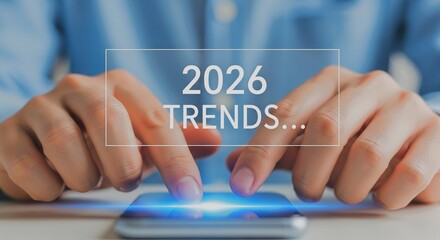 A person using smartphone to analyze 2026 Trends... The image captures a person's interaction with a smartphone, with the focus on the digital interface displaying the text 2026 TRENDS...