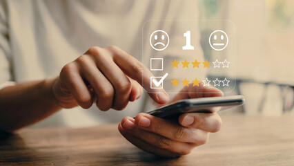 Customer satisfaction survey on smartphone, giving positive review with five star rating, business feedback and online experience for service quality