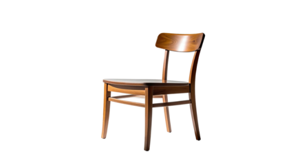 Wooden chair against black backdrop, spotlight accentuating it
