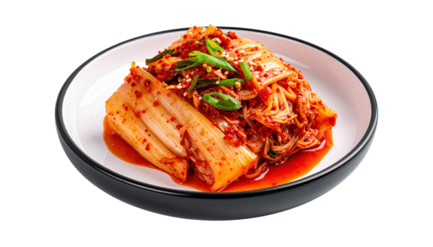 A Plate of Vibrant Red Kimchi with Scallions and Sesame Seeds