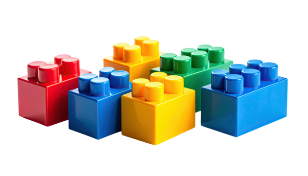 Colorful plastic building blocks, arranged against a black backdrop