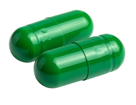 Close-up studio shot of two vibrant, emerald-green capsules on a stark black background. They appear smooth, glossy, and pharmaceutical-related