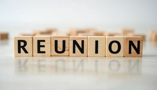 Wooden blocks spell reunion, signifying gathering. Concept of togetherness, reconnection, meeting again. Simple text blocks, isolated on white background, perfect for event invitation.
