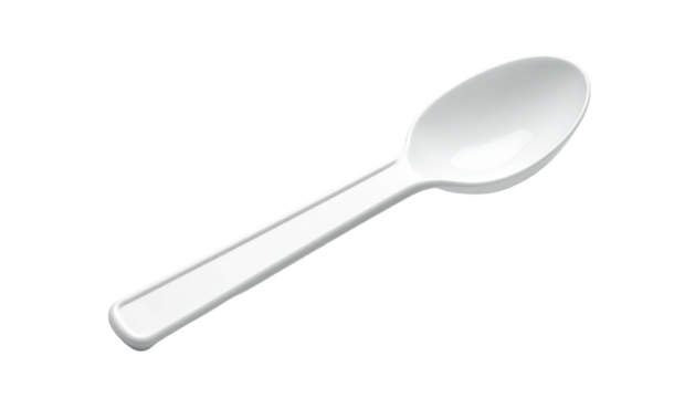 Simple white plastic spoon isolated against a black background